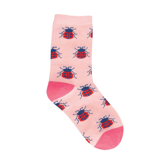 A pink crew sock with red and blue ladybug patterns and a pink heel and toe.