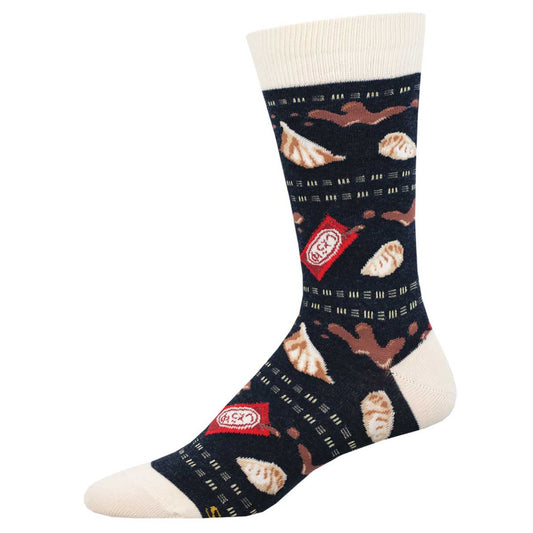 A pair of men's socks with a pattern that includes dumplings and soy sauce packets on a dark background.