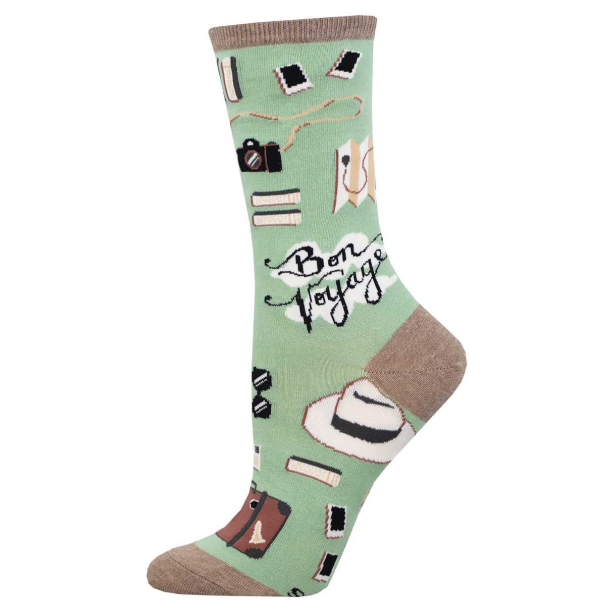 A pair of mint green cotton crew socks with travel-themed patterns including a plane, suitcase, and the text 'Bon Voyage'.