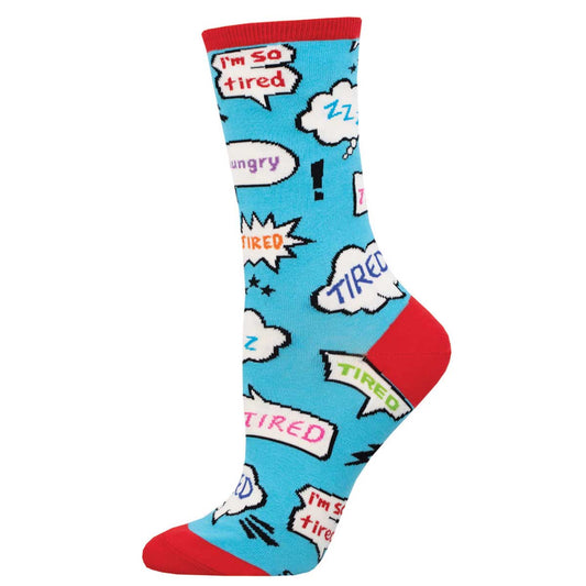 A pair of colorful crew socks with cartoon images and text bubbles depicting tiredness, designed for women.