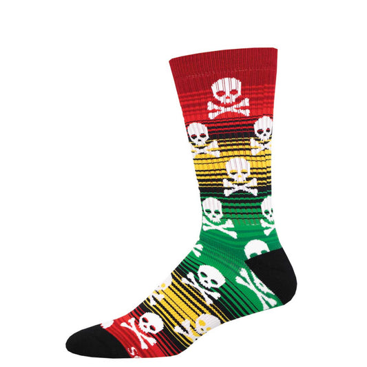 A pair of colorful crew socks featuring a pattern with skulls and stripes in red, yellow, green, and black colors.