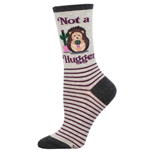 A pair of women's crew socks with a striped pattern featuring a graphic that says 'Not a Hugger' with a hedgehog holding a cactus.