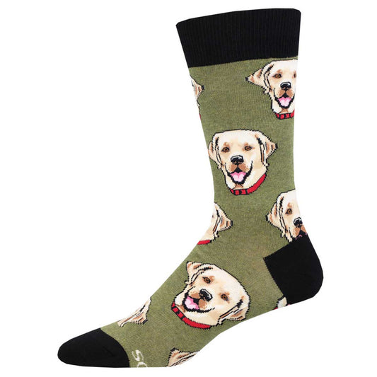 A pair of green crew socks with a pattern of Labrador dog portraits.