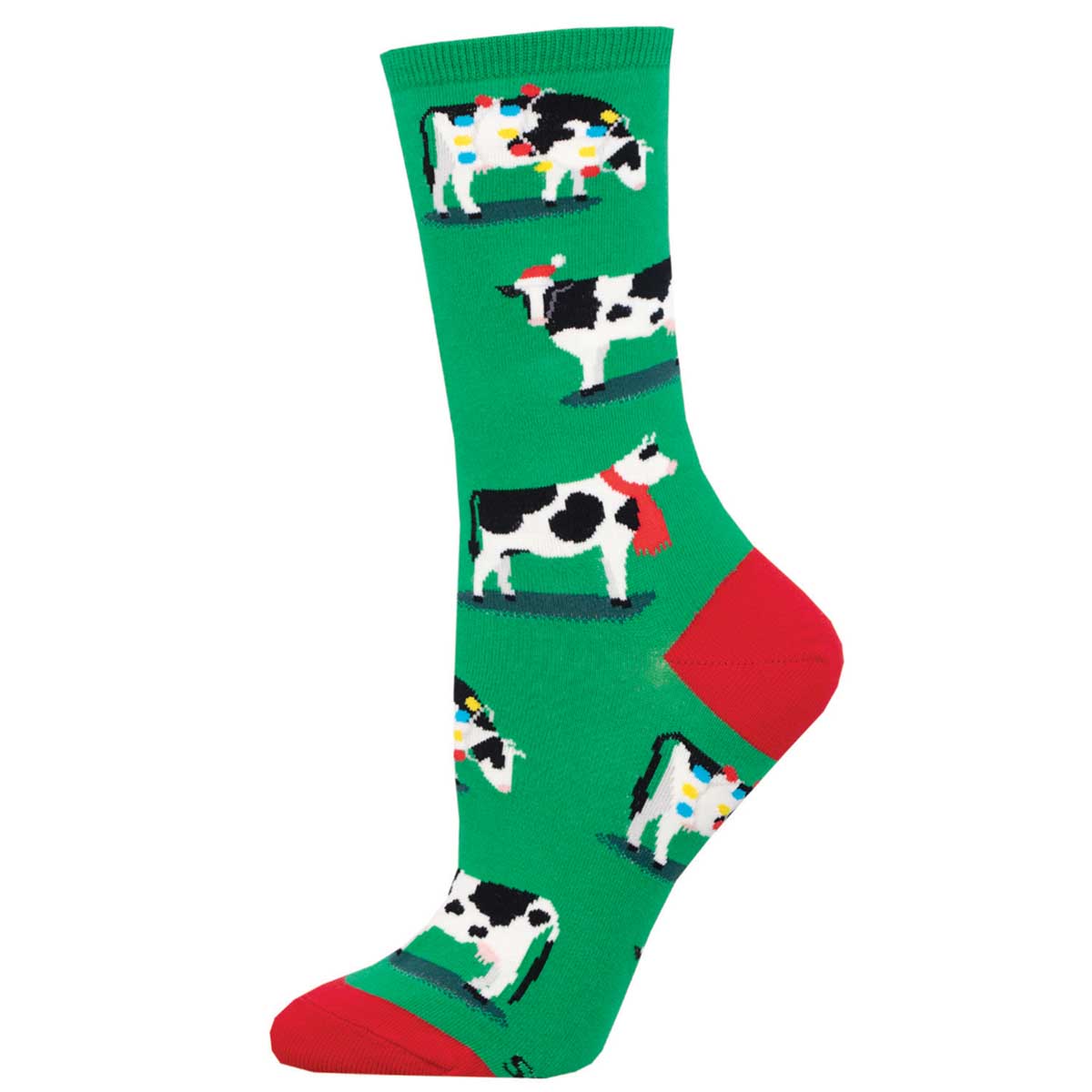 A green crew sock with a pattern of cows wearing holiday clothing, such as Santa hats and reindeer antlers, and red and green geometric designs on the heel and toe.