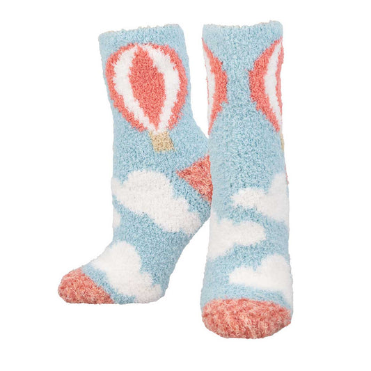 A pair of fuzzy socks with a hot air balloon design in blue, white, and pink colors.