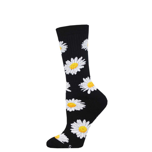 A pair of black crew socks with a floral pattern of white daisies for women.