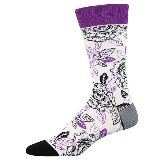 A pair of socks with a floral pattern in black, white, and purple colors, featuring a purple heel and toe.