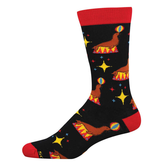 Colorful sock with a circus like seal and rainbow ball design on a black background