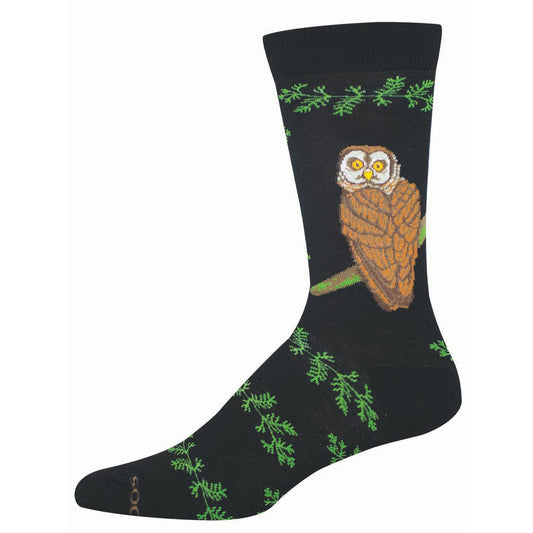 Black sock with an owl design and green foliage