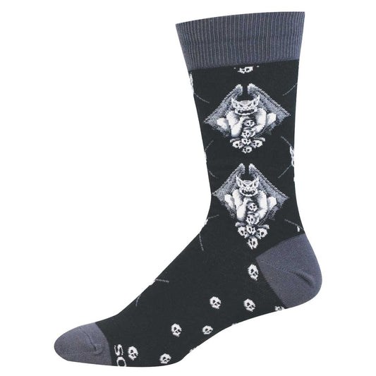 Black sock with white  and grey gargoyle and skull design arranged in an argyle pattern