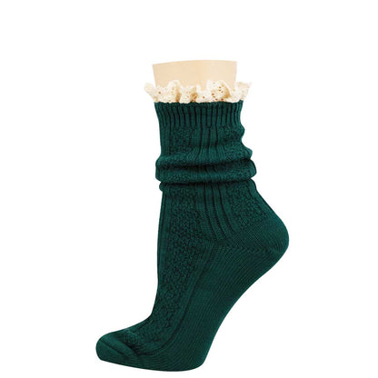 A single dark green ribbed knit sock with a cream lace ruffle at the top, displayed on a mannequin foot against a plain white background.