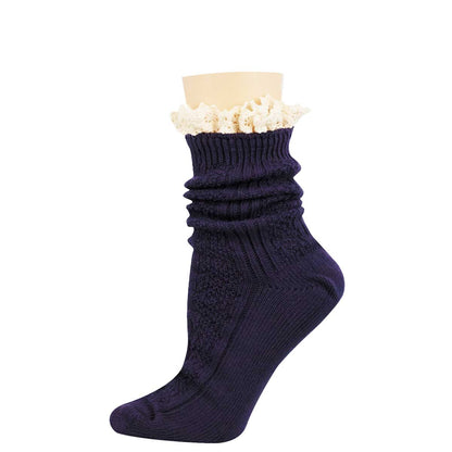 A single dark navy blue ribbed knit sock with a gathered, ruched texture and a decorative cream-colored ruffled trim at the top, displayed on a beige mannequin leg form against a plain white background.