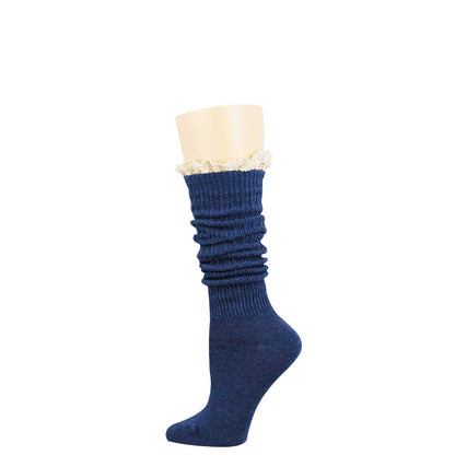 A single navy blue ribbed knee-high sock with a gathered, ruched texture and a white ruffled lace trim at the top, displayed on a beige mannequin leg against a white background.
