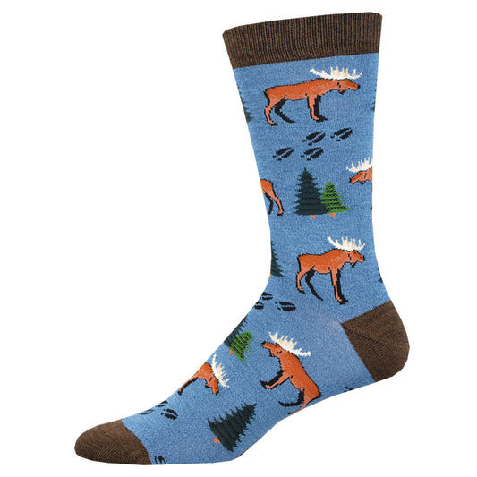 A pair of blue socks with a pattern featuring moose and trees.