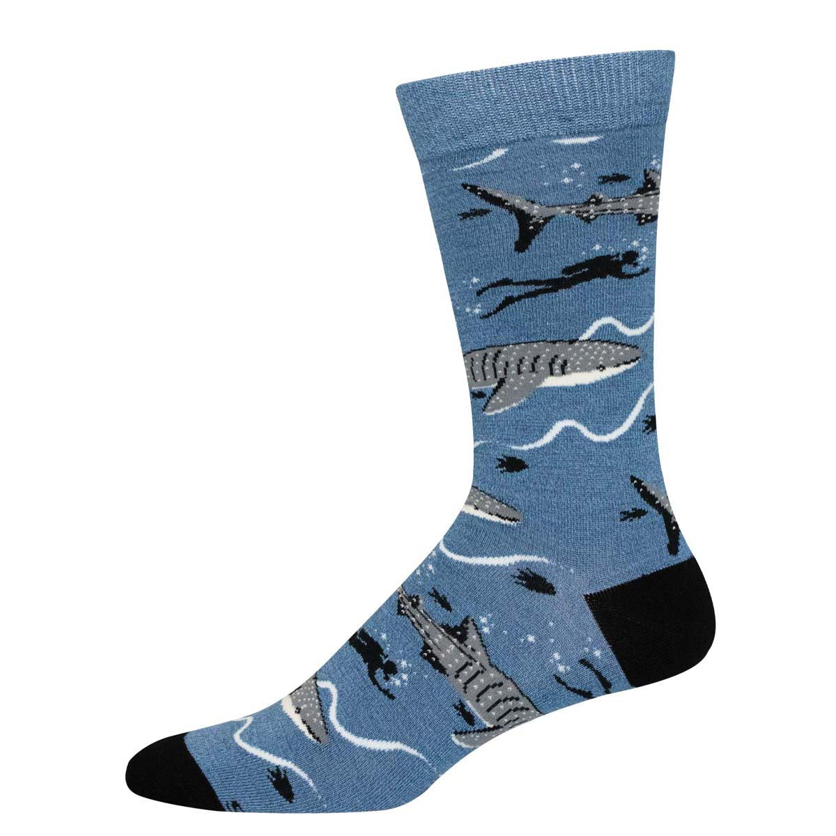 A pair of blue socks with a pattern featuring a whale shark and marine life.