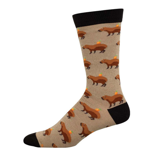 A pair of socks with a pattern of brown capybaras on a beige background.