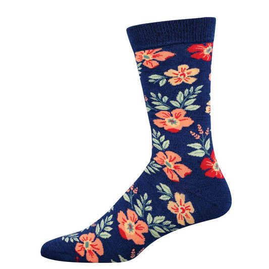 A pair of navy socks with a floral pattern featuring wildflowers in orange and blue.