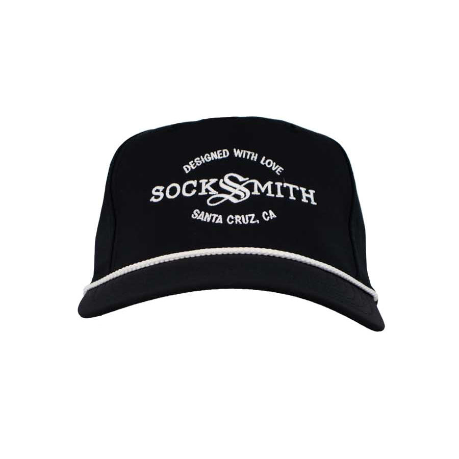 A black rope trucker hat with 'SOCKSMITH' branding and the text 'DESIGNED WITH LOVE Santa Cruz, CA' on the front.