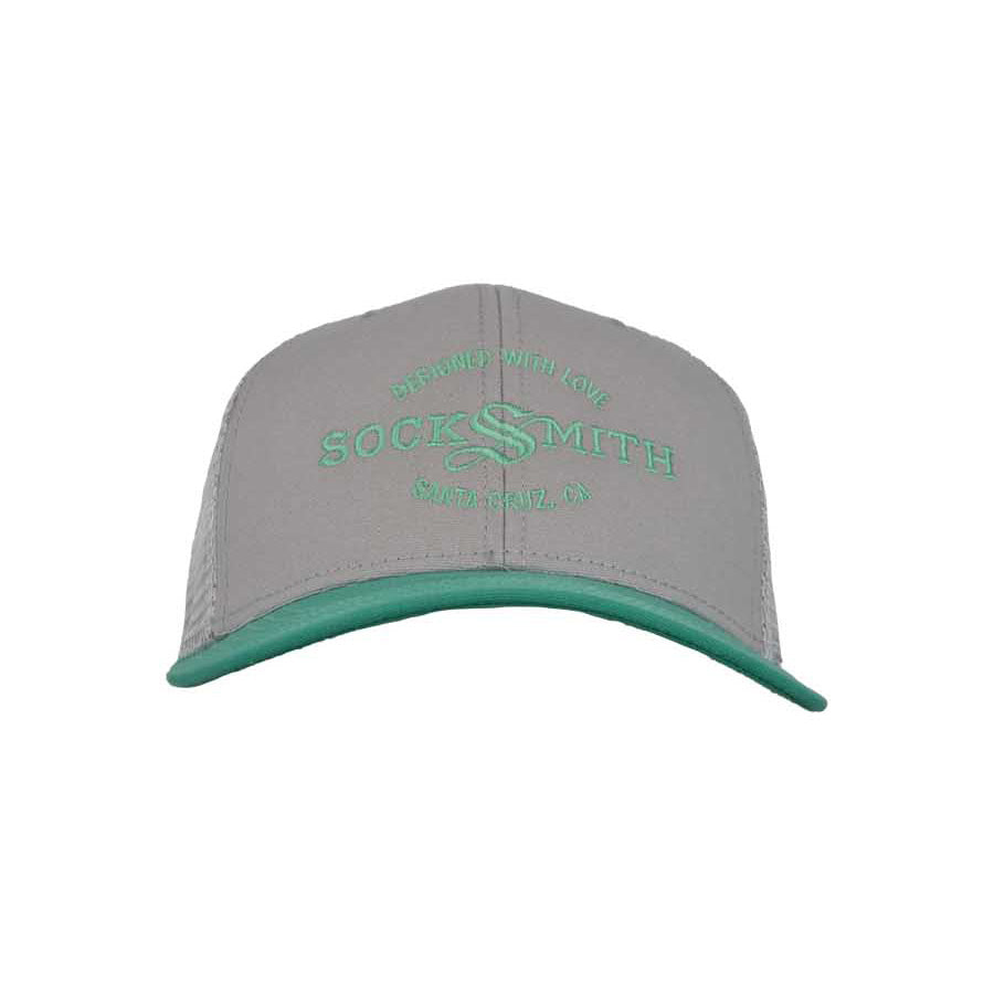 A light gray and teal trucker hat with 'SOCKSMITH' branding and the text 'DESIGNED WITH LOVE Santa Cruz, CA' on the front.