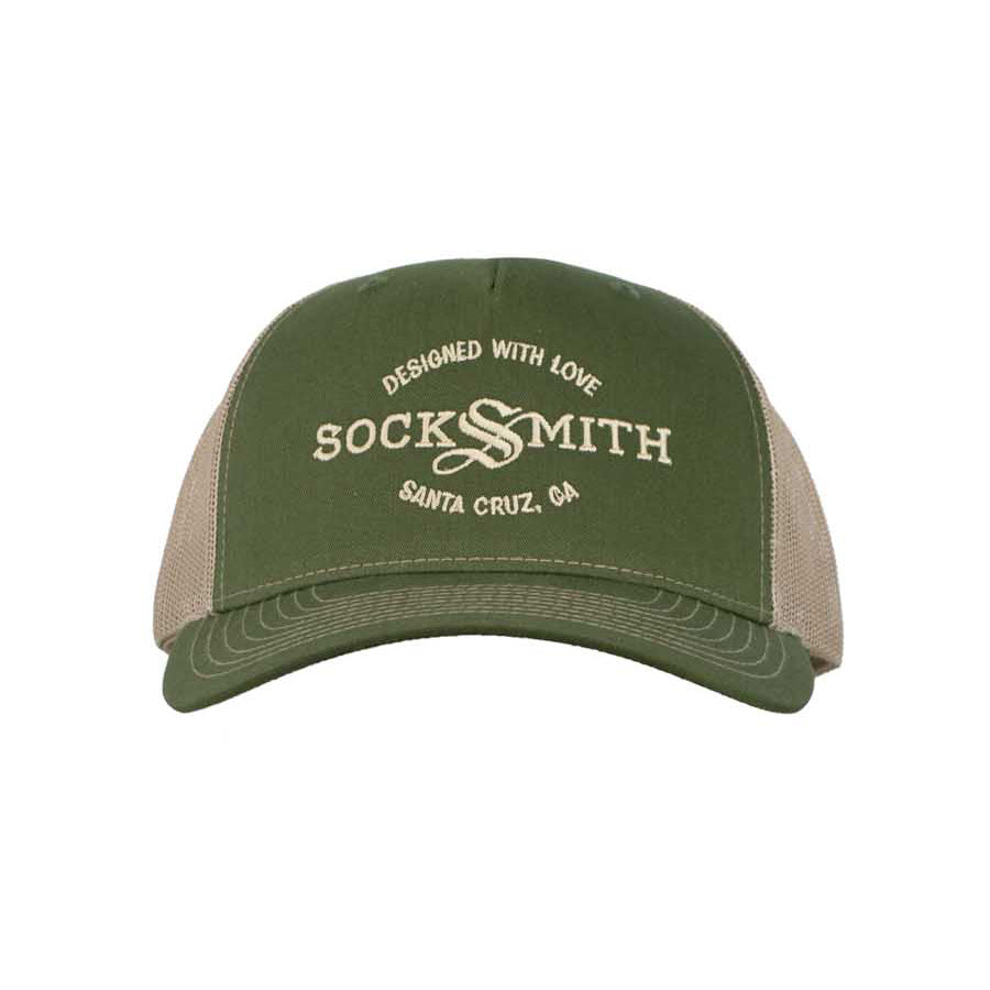 A green and beige trucker hat with 'SOCKSMITH' branding and the text 'DESIGNED WITH LOVE Santa Cruz, CA' on the front.