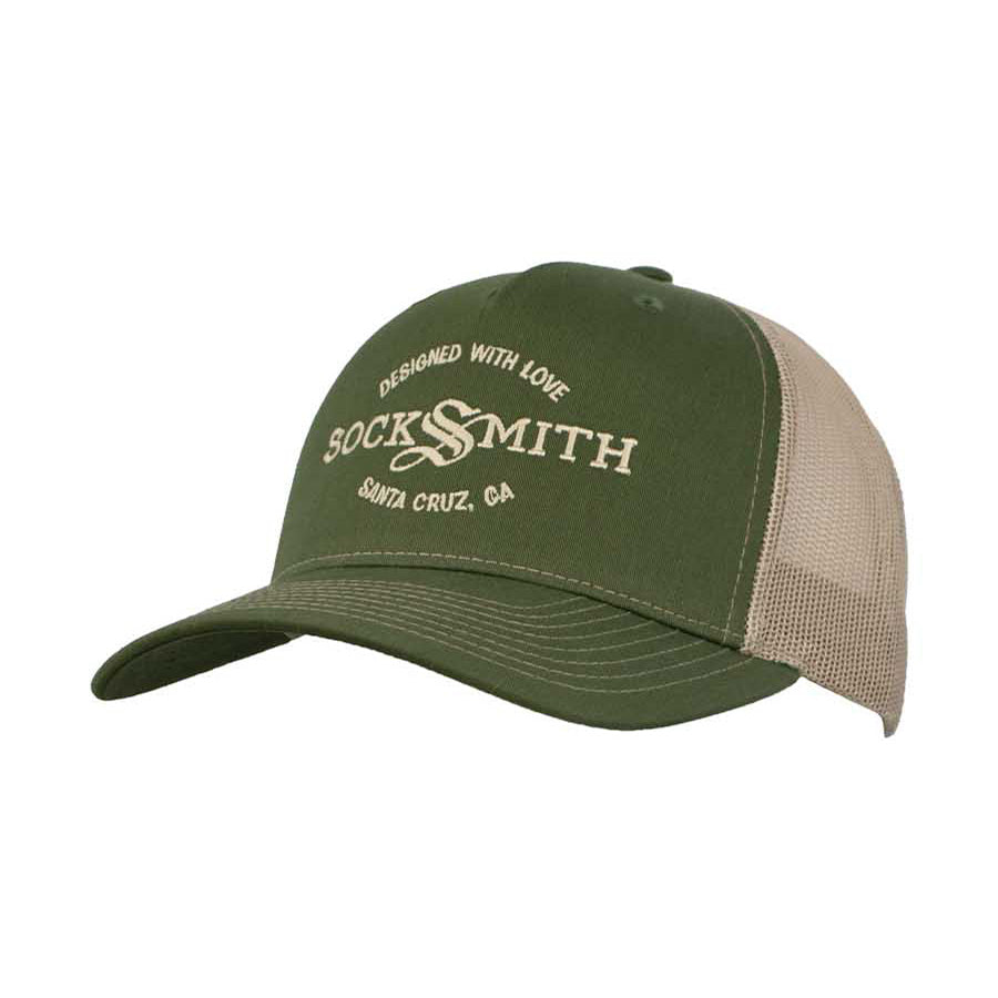 A green and beige trucker hat with 'SOCKSMITH' branding and the text 'DESIGNED WITH LOVE Santa Cruz, CA' on the front.