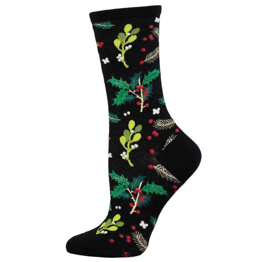 A pair of black cotton crew socks with a Christmas pattern featuring mistletoe and holly.