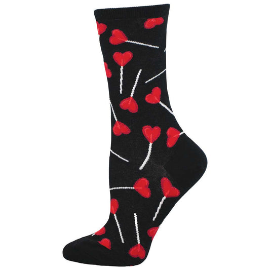 A pair of black crew socks with a pattern of red lollipops and hearts.