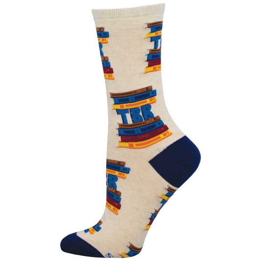 A pair of cotton crew socks with a pattern resembling stacked books in blue, red, and yellow on a beige background.