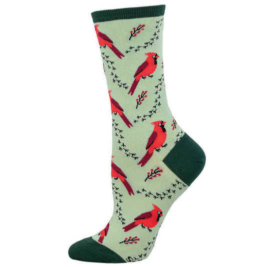 A pair of green crew socks with a pattern of red cardinals and greenery.