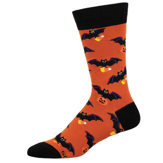 A pair of orange socks with black bats and pumpkin patterns.
