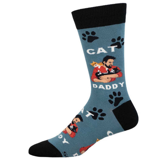 A pair of blue crew socks with text 'CAT DADDY' and images of a man with cats and cat paw prints.