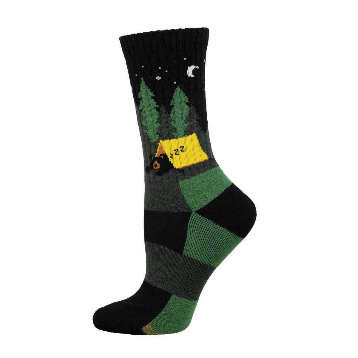 A crew length Merino wool sock with a pattern that includes a camping scene with trees, a moon, and a tent.