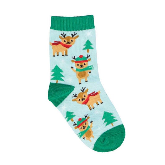 A pair of kids' socks with a Christmas theme, featuring reindeer and green tree patterns on a frosty blue background.