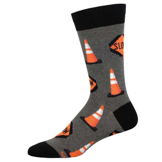 A pair of gray crew socks with orange traffic cones pattern and the text 'SLOW' on them.