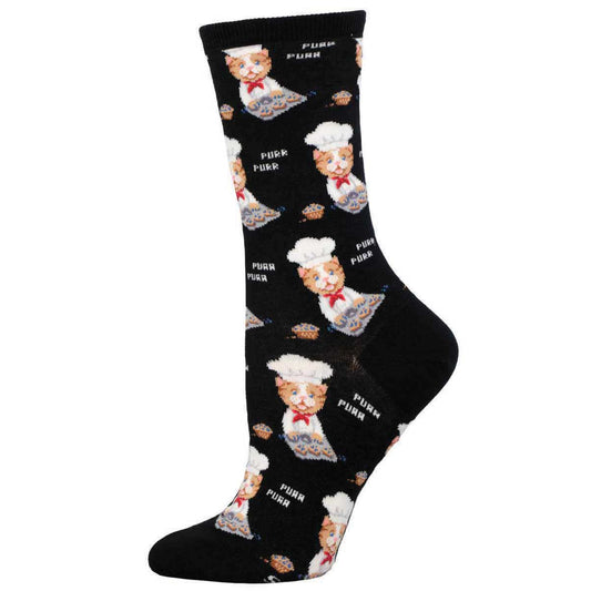 A pair of black socks with a pattern of cartoon cats wearing chef hats and baking muffins.