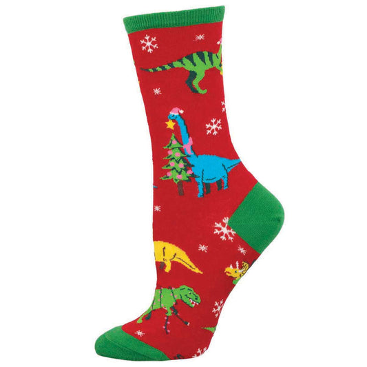 A pair of colorful crew socks with a Christmas theme, featuring various dinosaurs wearing Santa hats on a red background with green trim.