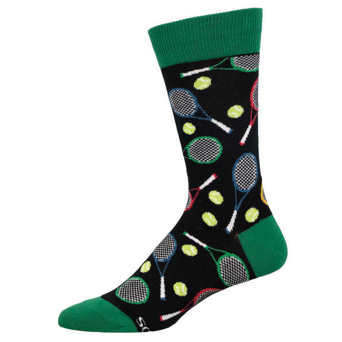 A pair of men's crew socks with a tennis theme, featuring images of tennis rackets and tennis balls on a black background, with green cuffs.