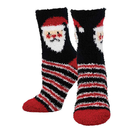 A pair of fuzzy Christmas-themed socks featuring a striped pattern with Santa Claus design in black, red, and white colors.