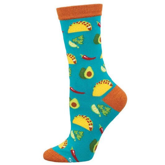 A colorful sock with a pattern of tacos, avocados, and other food items on a blue background with an orange cuff.