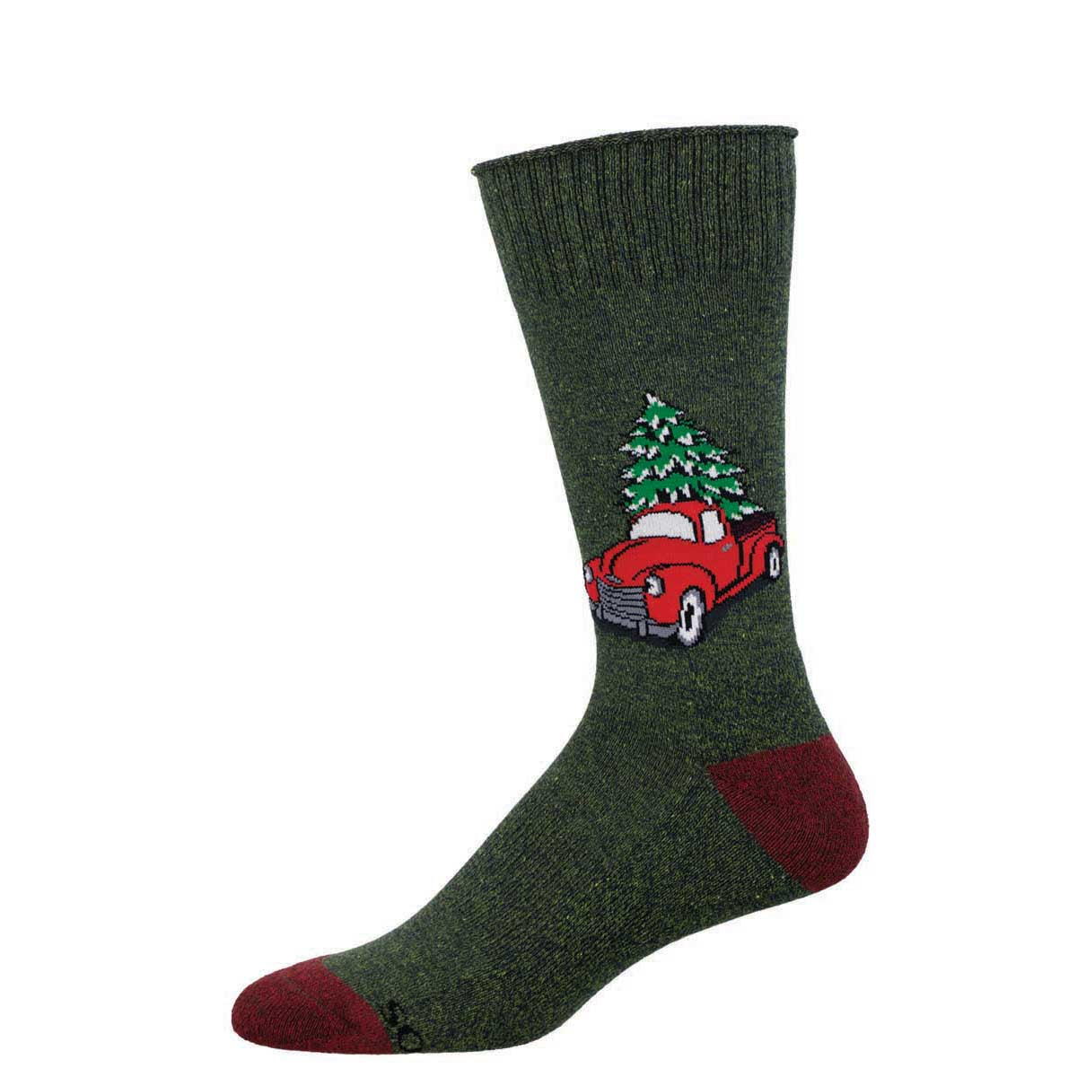 A green sock with a red truck and a Christmas tree in the bed.