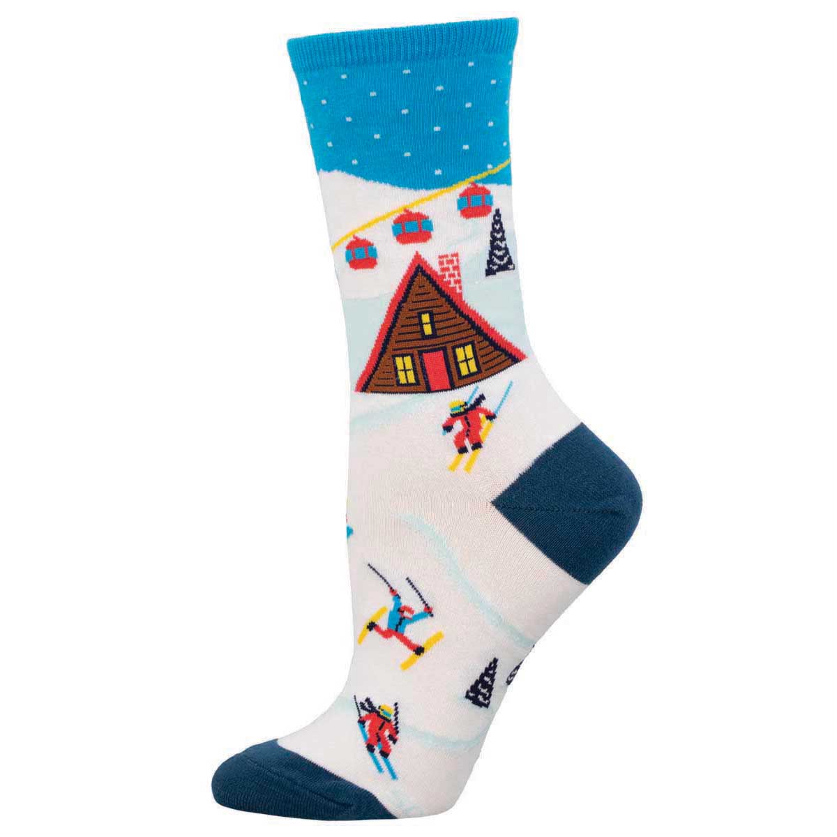 A pair of colorful crew socks with a ski lift, trees, and a cabin design on a white background.