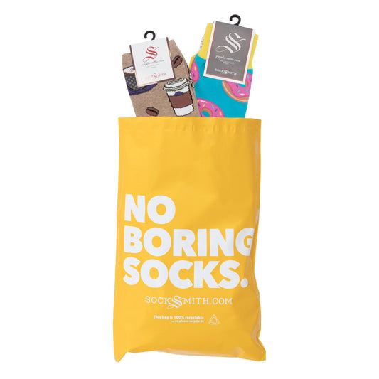 An example of a Mixed Sock of the Month Subscription bag with two pairs of socks inside, one sized for men and one sized for women.